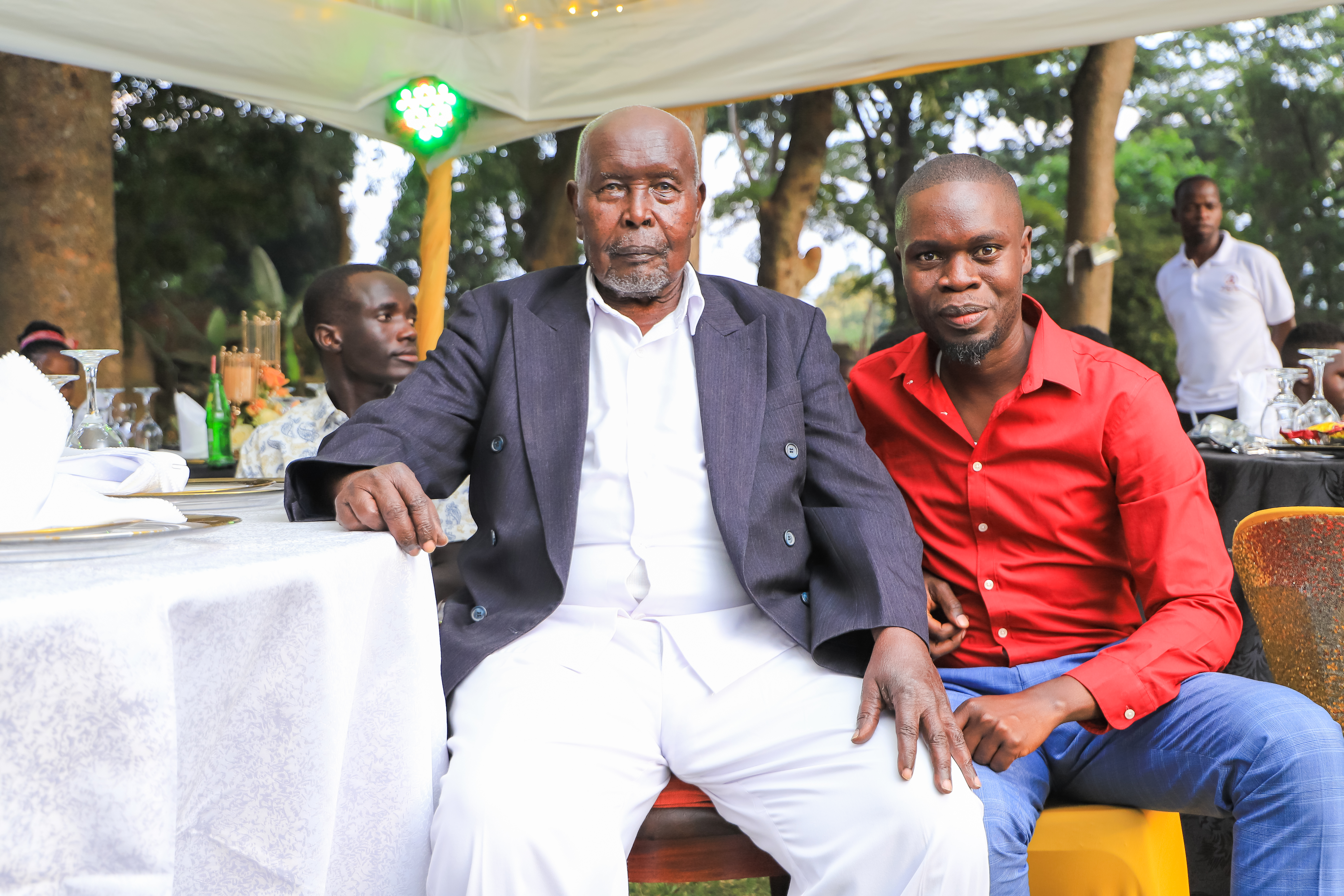 Baba smiling with family